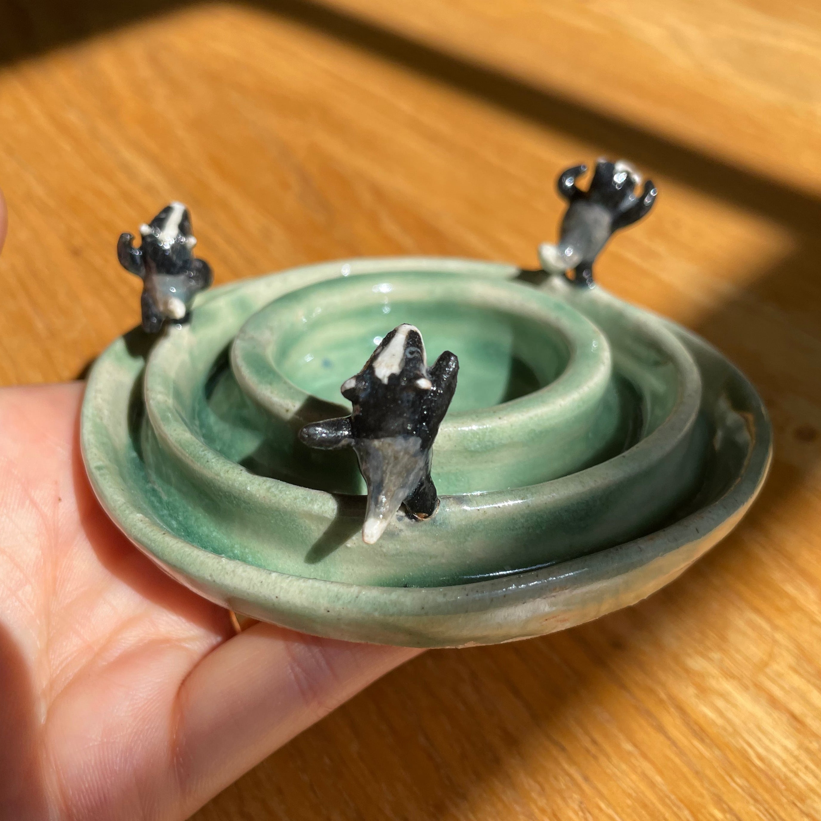 Dancing badgers tea light holder