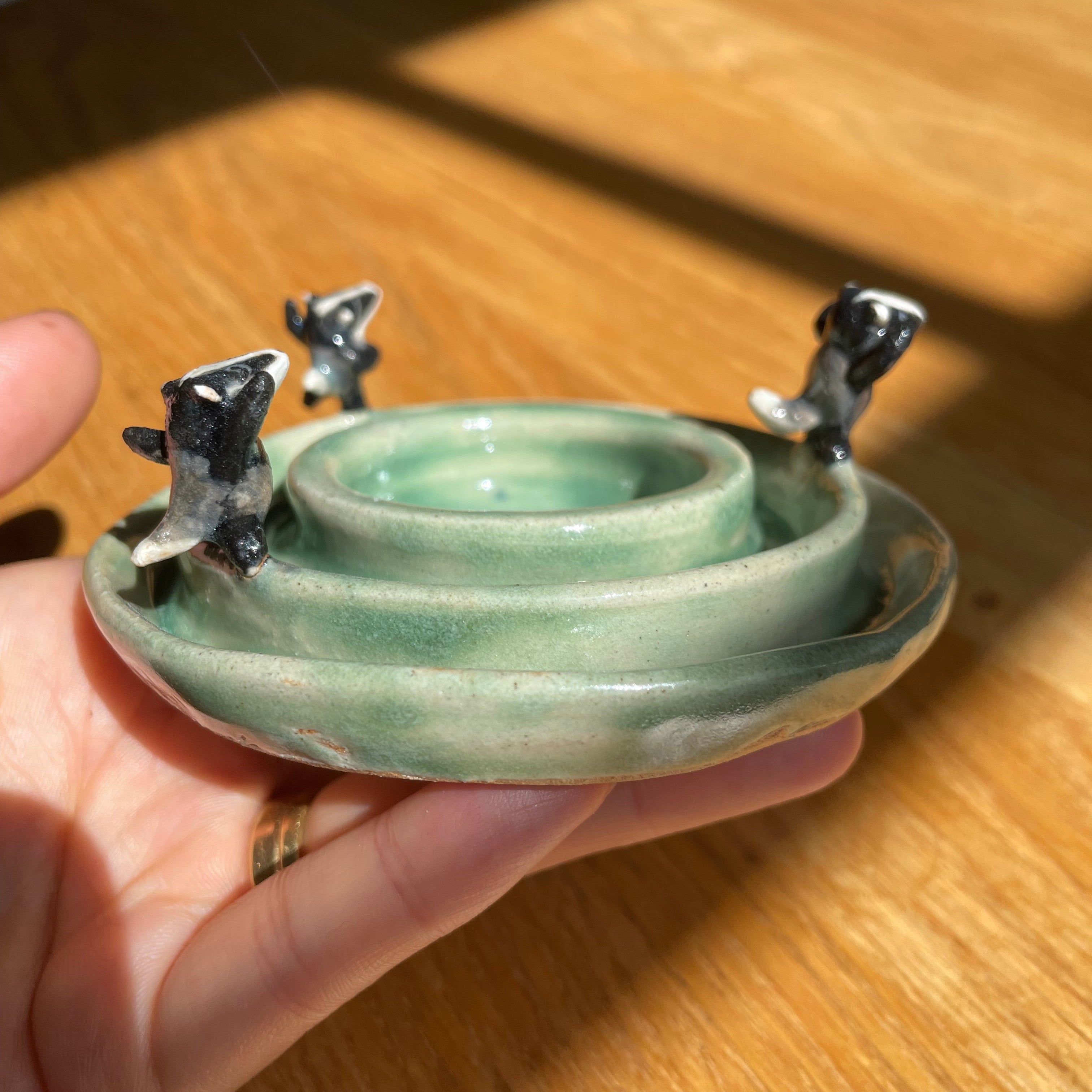 Dancing badgers tea light holder