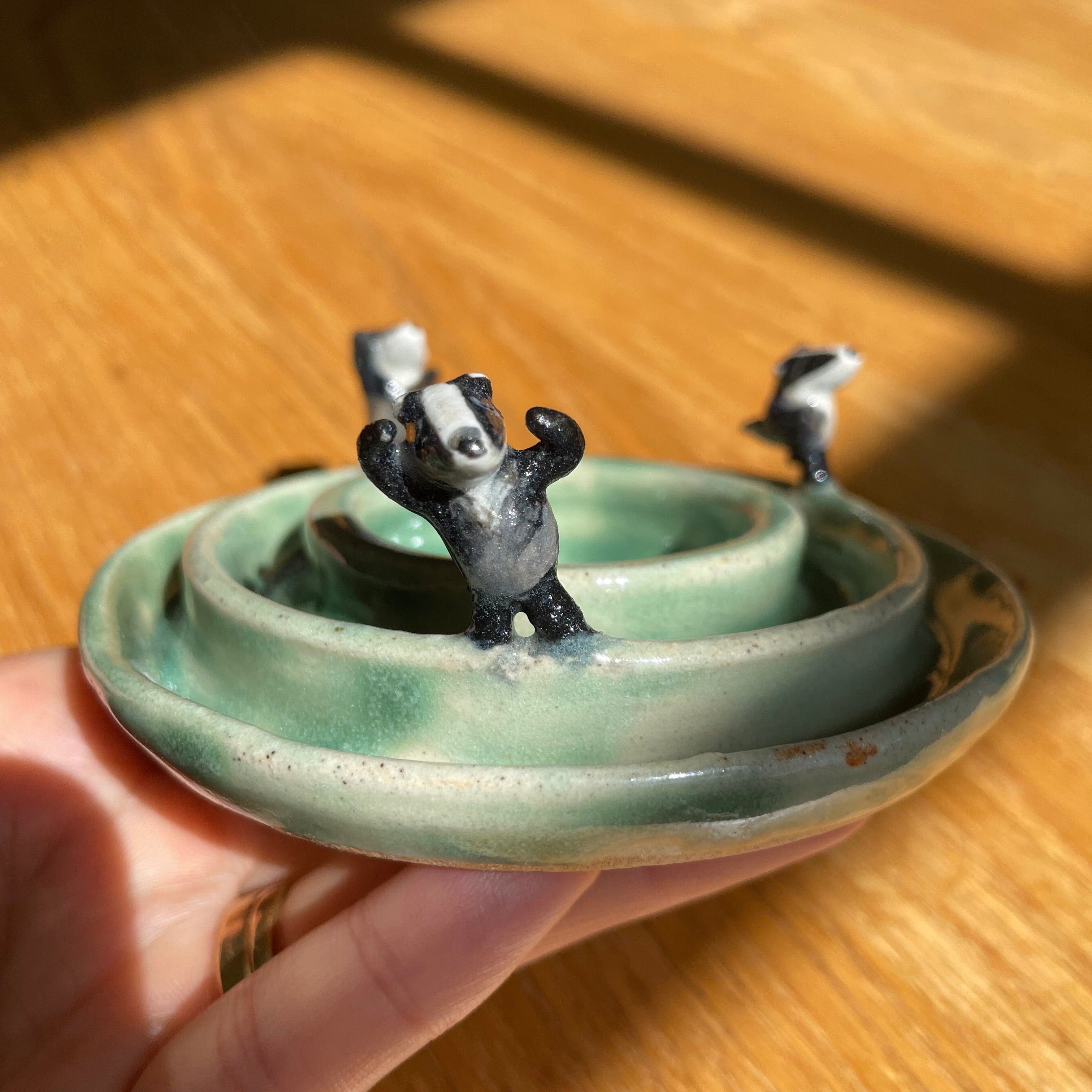 Dancing badgers tea light holder