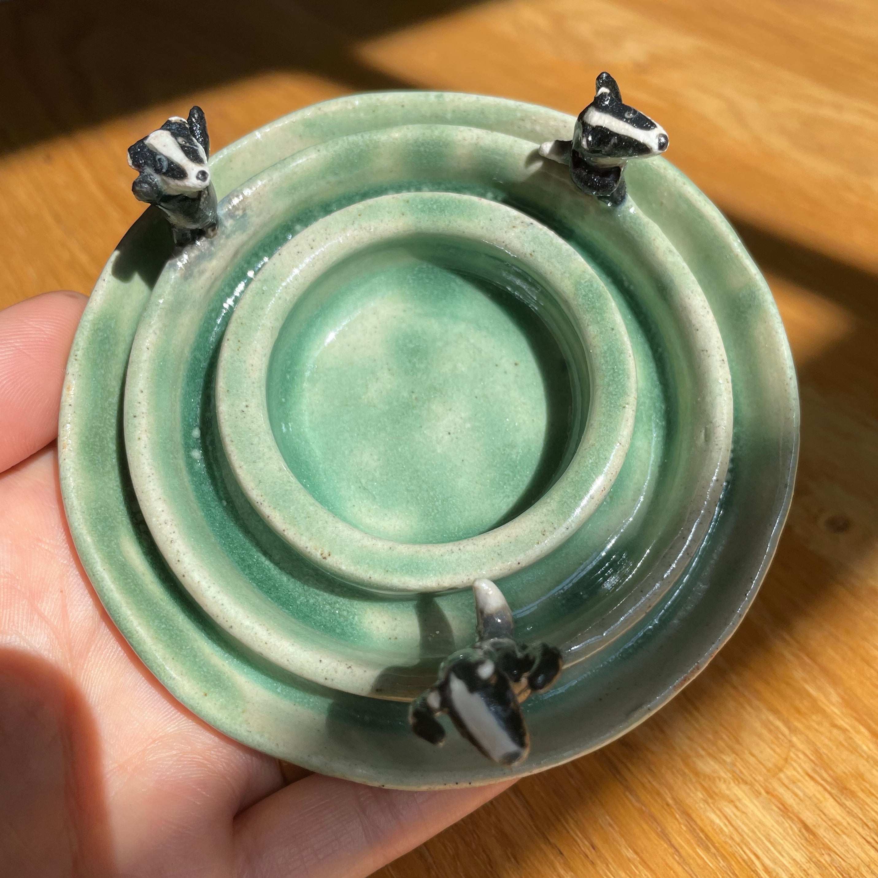 Dancing badgers tea light holder