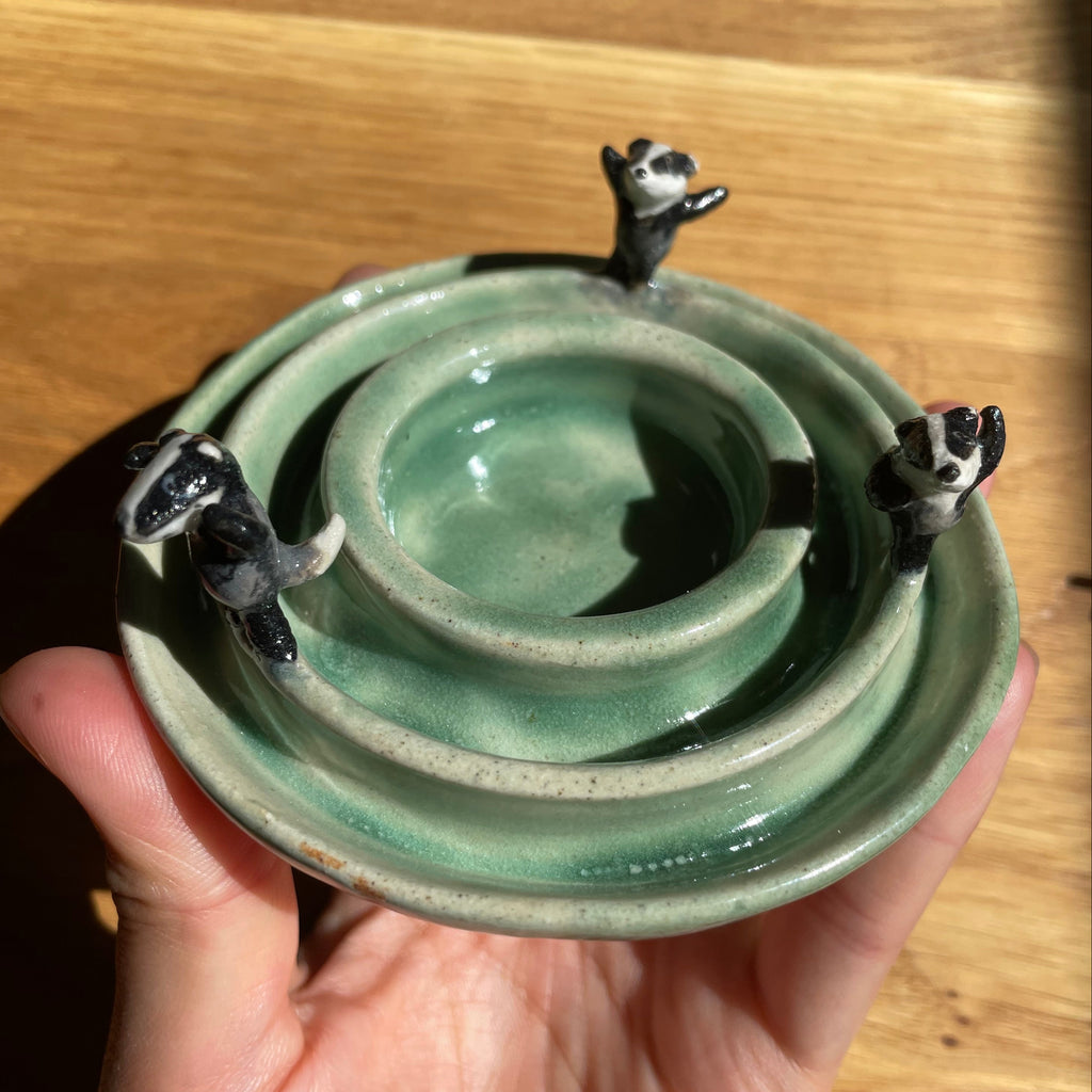 Dancing badgers tea light holder