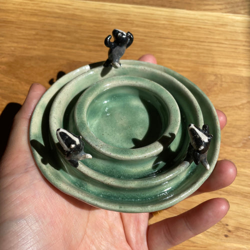 Dancing badgers tea light holder