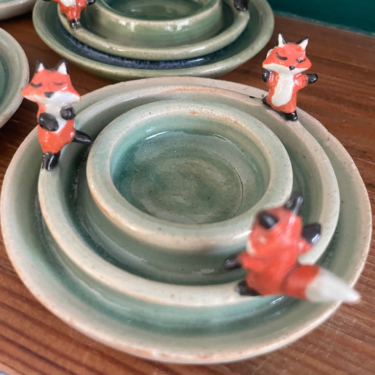 Dancing foxes candle holder