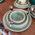Dancing badger candle holder (light green)
