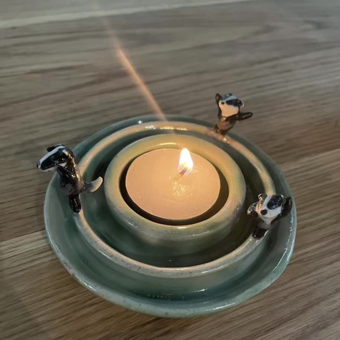 Dancing badgers tea light holder