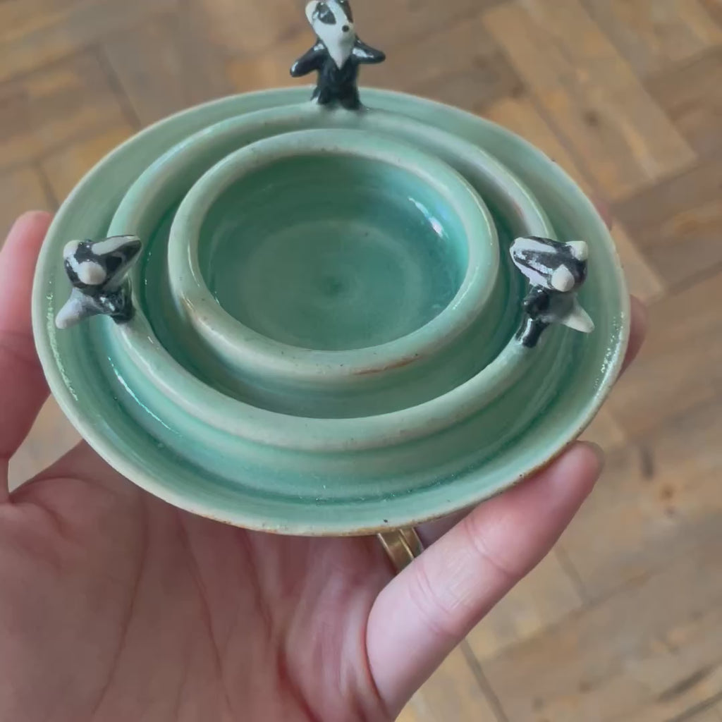 Dancing badger candle holder (light green)