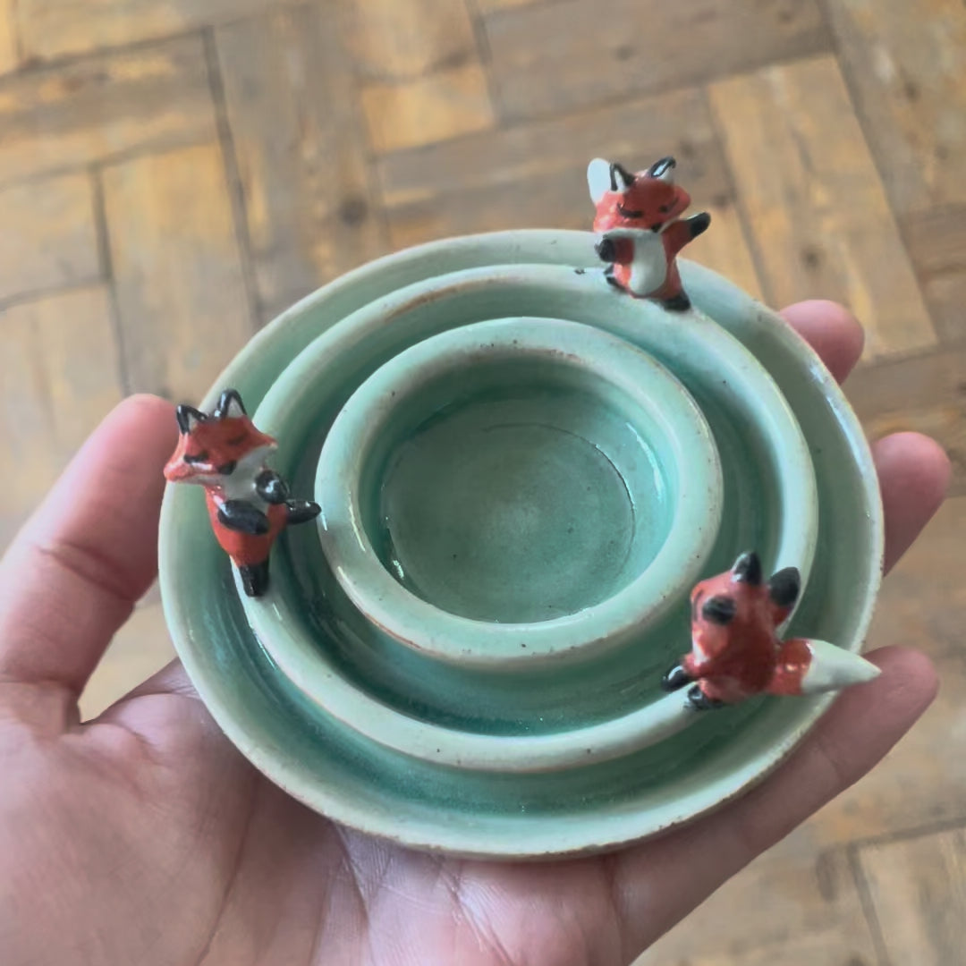 Dancing foxes candle holder